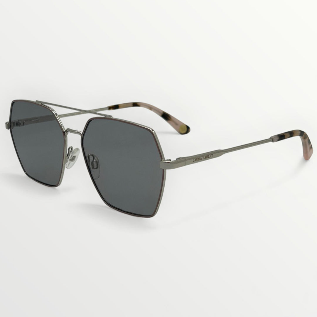 Sunglasses with dark lenses and thin metal frame on a white background