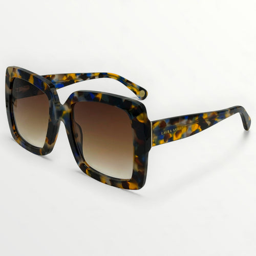 Sunglasses with tortoiseshell frame and gradient lenses on a white background