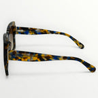 Sunglasses with tortoiseshell frame on a white background