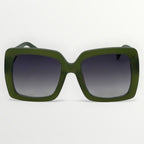 Green sunglasses with dark lenses on a light gray background