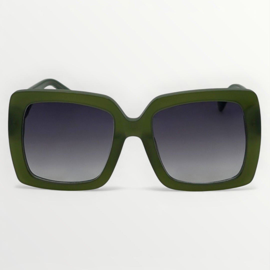 Green sunglasses with dark lenses on a light gray background