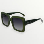 Green sunglasses with a gradient lens on a white background