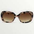 Sunglasses with tortoiseshell frame and brown gradient lenses on a white background
