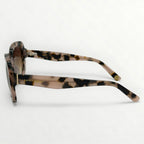 Sunglasses with tortoiseshell frame on a white background