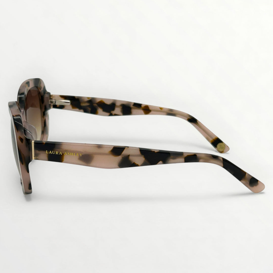 Sunglasses with tortoiseshell frame on a white background