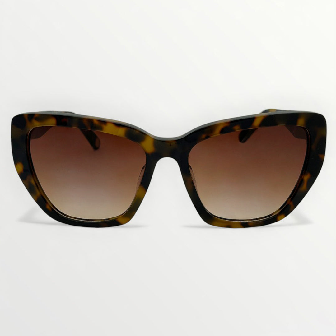Sunglasses with tortoiseshell frame and brown gradient lenses on a white background