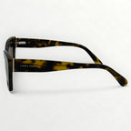 Sunglasses with tortoiseshell frame on a white background
