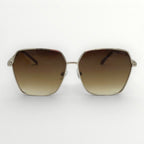 Sunglasses with brown gradient lenses and gold frame on a white background