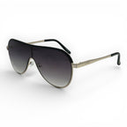 Sunglasses with black gradient lenses and gold frame on a white background
