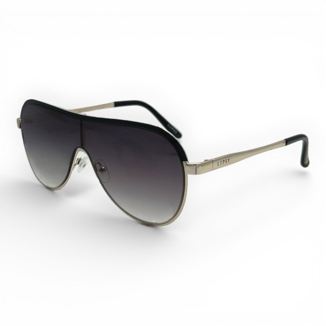 Sunglasses with black gradient lenses and gold frame on a white background