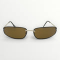 Sunglasses with gold frame and brown lenses on a white background