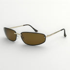 Sunglasses with brown lenses and gold frames on a white background