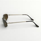 Sunglasses with black frames and dark lenses on a white background