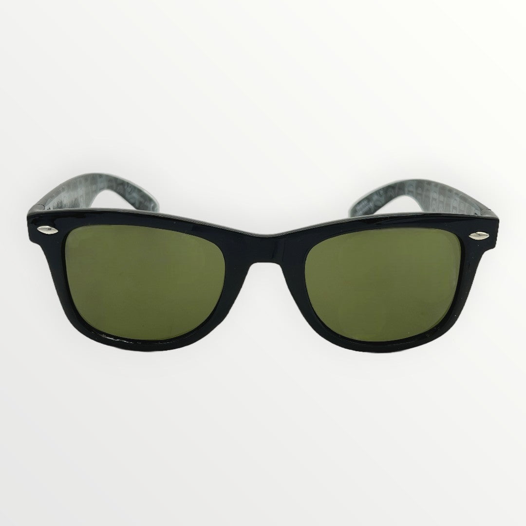 Black sunglasses with green lenses on a white background