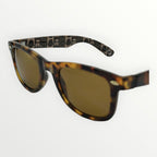 Sunglasses with tortoiseshell frame and gold lenses on a white background