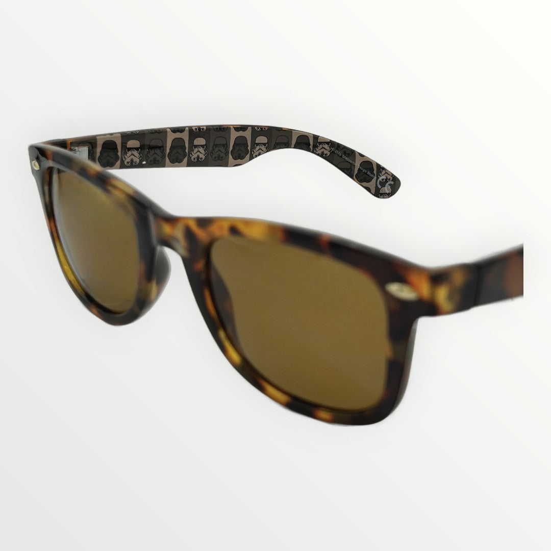 Sunglasses with tortoiseshell frame and gold lenses on a white background
