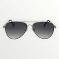 Aviator sunglasses with dark gradient lenses on a white background