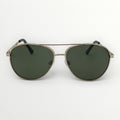 Aviator sunglasses with green lenses on a white background