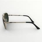 Sunglasses with gold frame and black accents on a white background