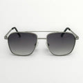 Sunglasses with dark gradient lenses and metallic frame on a white background