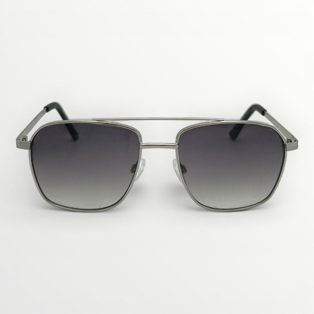 Sunglasses with dark gradient lenses and metallic frame on a white background