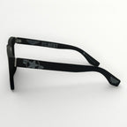 Black eyeglasses with text on a white background