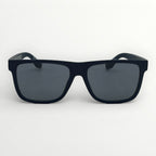 Black sunglasses with dark lenses on a white background